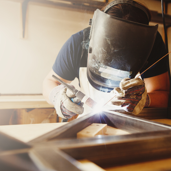 person wearing a welding mask